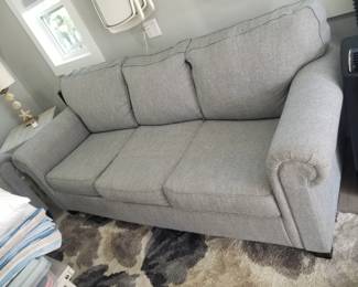 Sleeper sofa in a neutral gray