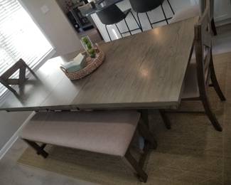 Dining set seats 8; includes table with leaf (as shown); two chairs & two upholstered benches