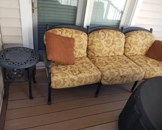 Patio couch; accent table