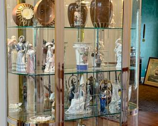 This is a Glass Display Case with 3 Glass Shelve. It is Brass and Silver Frame that will sure to display your collections