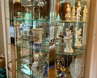 This is a Glass Display Case with 3 Glass Shelve. It is Brass and Silver Frame that will sure to display your collections
