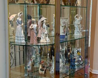 This is a Glass Display Case with 3 Glass Shelve. It is Brass and Silver Frame that will sure to display your collections