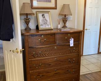 chest of drawers, lamps, framed art