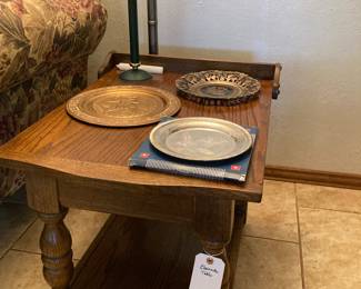 end table, decorative plates, emergency candle lamp