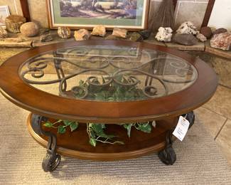 oval cocktail table with tempered glass