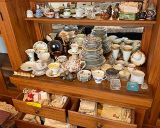 China pieces, tea cups.
Doilies and linens