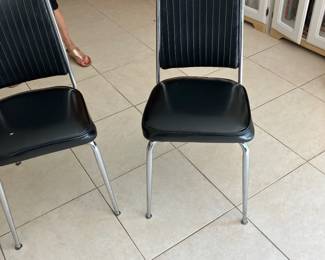 Two black and metal chairs