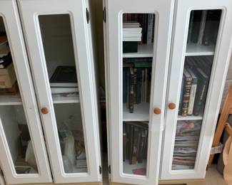 Two white storage cabinets