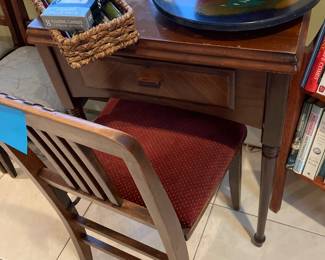 Singer sewing machine in cabinet