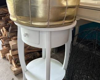 Pottery Barn Kids bedside table. Leather Morrocan poufs in gold and silver.