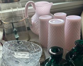Milk Glass Hobnail pitcher and glasses. Cut crystal bowls. Colored glass candlesticks.