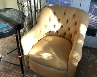 Upholstered club chair on wheels