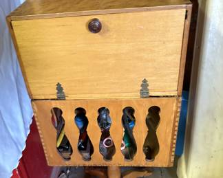Vintage sewing stand packed with sewing items