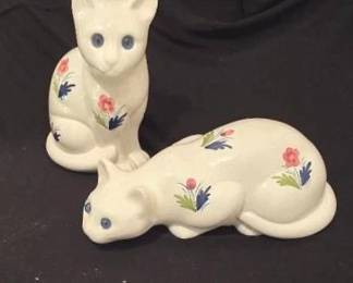 These ceramic cats are from Portugal and feature a white color with pink flowers painted on, one cat