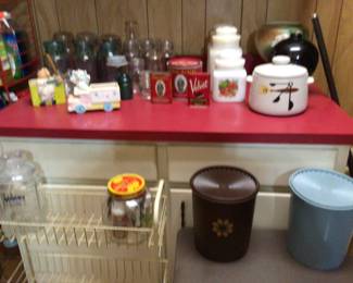 rolling storage cart, vintage glass bake canisters, vintage atlas & ball canning jars, vintage Tupperware nesting canister sets