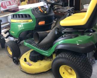 John Deere E130 riding mower with grass catchers. Only 77 hours of use. $3400.