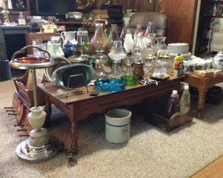 Laminate top coffee table $60., end tables with laminate tops (2) $50. Each.; oil lamps, decor, crocks, vintage chrome/granite light up smoking stand $75