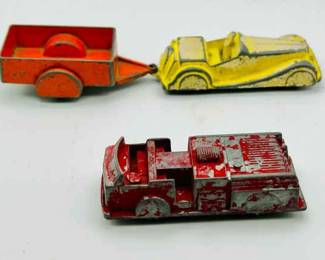 (3) Vintage MIDGETOY Diecast Metal Toy Cars & Fire truck
Two vehicles and a trailer that attaches to a vehicle. All roll ok. See photos for condition