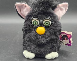 Furby
Model 70-800, white paws are a little stain. Requires batteries.