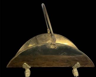 Footed brass log holder 