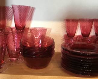 Pink glasses, plates and bowls
