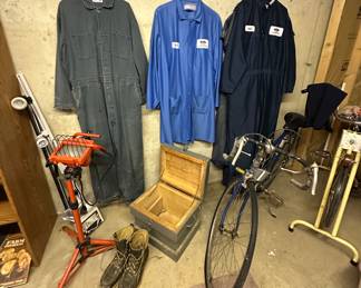 Work/ Ford Jumpsuits; Small Wooden Trunk; Work Boots; Ten Speed Bike; Exercise Bike