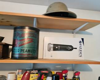 Stapler, WD-40, Planters Salted Peanuts container.
