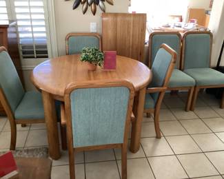 Ashley Oak dining table with six chairs and one center leaf