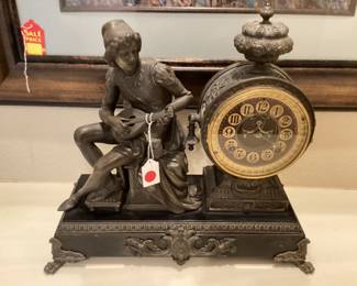 Antique bronze clock with two urns