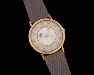 Lot 219: Longines 14k Gold & Diamond Mystery Dial Watch