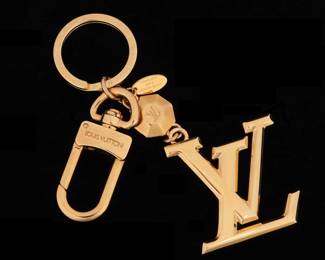 Lot 86: Louis Vuitton Gold Toned Monogram Key Chain