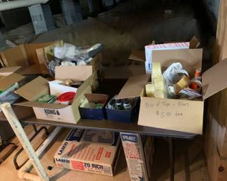 Boxes of plumbing, electrical, tape and glue