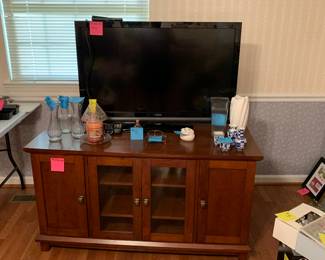 Here is another flatscreen TV with a very nice TV stand that comes with lots of storage for all of your components.