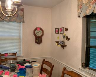 Wall decor plus a dining room table and chairs