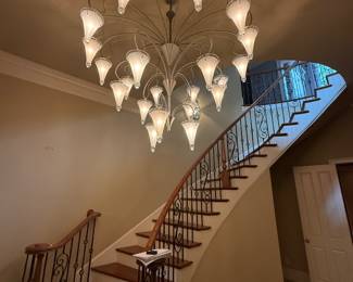 New lighting still hanging in new home and must be reserved to look at before the sale.