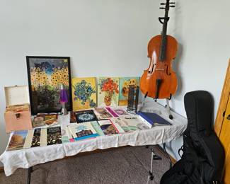 Cello, stands, sheet music, 45s, and art