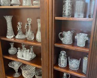 Bookshelves full of high end cut glass crystal