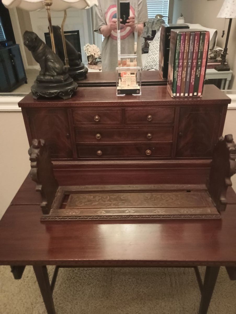 Small, pretty antique desk, which folds down to make larger, and up to make smaller. Drawers and little cubbies.