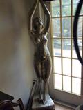 THIS IS AN ART DECO METAL FIGURINE WITH A LIGHT.