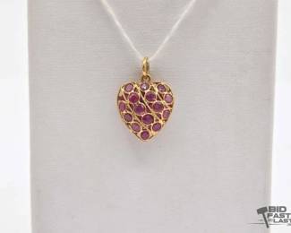 604  18k Gold and Ruby Pendant, 1.3g 