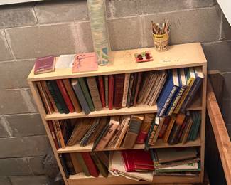 Bookcase at stairs leading to basement & books!