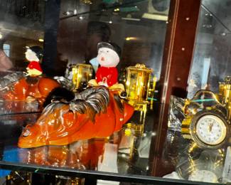 Looks like Thelwell?   and lots of lovely Miniature Clocks
