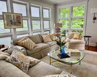 Vintage lithos, the most lovely rug of all time, MCM glass and brass coffee table, custom pillows and awesome metal side tables