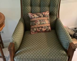 Dark green chair with wood trim.  Presale $125