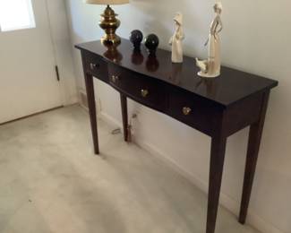 Sofa table…measures 42  l x 13 d x 30 h.  Presale $85