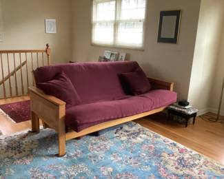 Futon…measures 80 l x 42” d x 35” h.  Presale $100