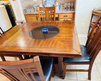 This is a seriously well-made poker table with a built-in rotating center for the potato chips.  Can also be used to eat on.  