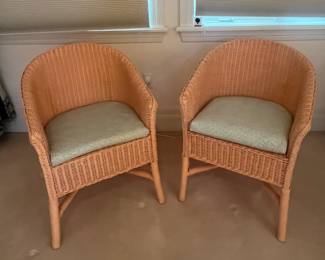 Pair of coral colored wicker side chairs