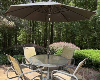 Outdoor table with 4 chairs and umbrella