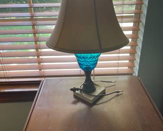 Two small blue glass lamps